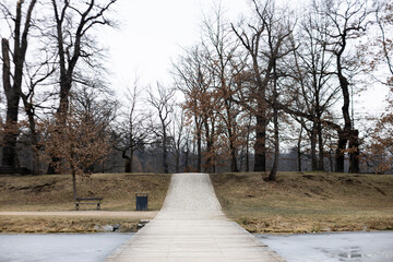 Wooden footbridge leading to stromovka park in prague during winter