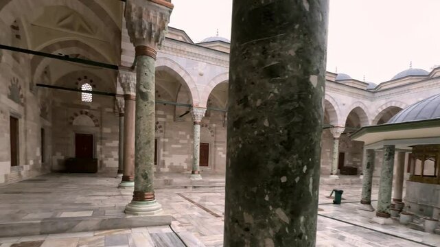 Courtyard of Historic Bayezid II Mosque with Marble Columns and ablutions fountain in the middle, Istanbul, Turkey
