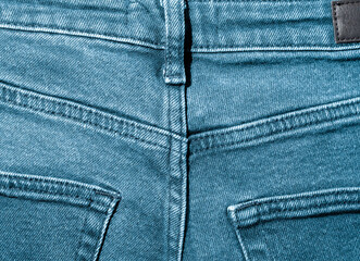 Fototapeta premium Blue jeans back pocket as a background.