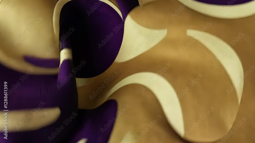 Poster a purple and yellow fabric with a swirl pattern. the purple is on the left and the yellow is on the 