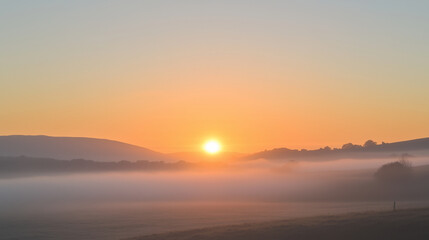 A peaceful and serene sunrise over a calm landscape. Perfect for themes related to tranquility, nature, and morning inspiration