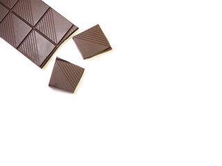 Bar of dark chocolate isolated on white background. Copy space.