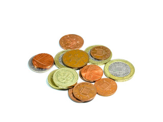 Piles of British coins isolated on white background