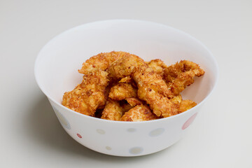 chicken croquettes in a bowl on a table