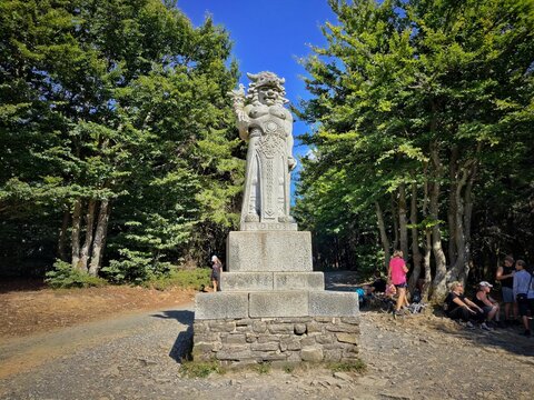 A striking stone statue of Radegast, the Slavic god of hospitality, war, and harvest, standing proudly on Radho&scaron;ť mountain in the Czech Republic. 
