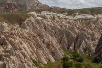 Cappadocia’s colorful rock formations, shaped by wind and water erosion, create a surreal landscape. Layers of volcanic rock reveal history, while valleys and cliffs form an awe-inspiring natural wond
