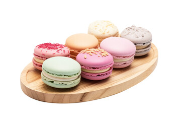 Fototapeta premium Mixed macaron cookies in bright and pastel hues placed on a wooden board, isolated on white background