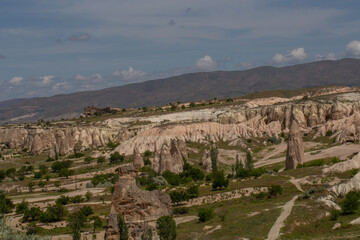 Cappadocia’s colorful rock formations, shaped by wind and water erosion, create a surreal landscape. Layers of volcanic rock reveal history, while valleys and cliffs form an awe-inspiring natural wond