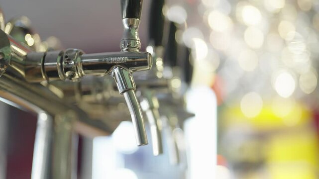 Frothy Beer Poured at a Bar Counter