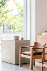 Modern interior design featuring a wooden chair and minimalist decor in a bright space