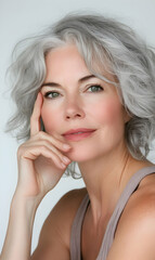 Obraz premium Elegant portrait of a mature woman with silver hair, exuding confidence and poise