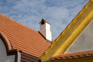 Roof of a house with chimney, Holasovice, Czechia