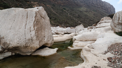 Exploring the unique rock formations and water flow in Kalysan Canyon Socotra