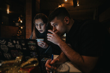 Two friends studying together in a cozy cafe environment during the holidays