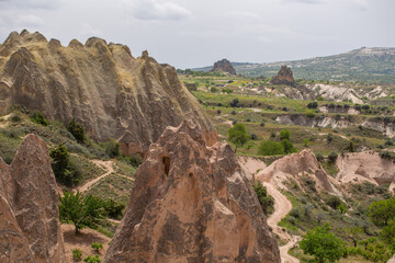 Cappadocia’s colorful rock formations, shaped by wind and water erosion, create a surreal landscape. Layers of volcanic rock reveal history, while valleys and cliffs form an awe-inspiring natural wond