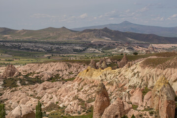 Cappadocia’s colorful rock formations, shaped by wind and water erosion, create a surreal landscape. Layers of volcanic rock reveal history, while valleys and cliffs form an awe-inspiring natural wond