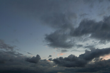 Beautiful cloudy sky after the rain. Panoramic view of the stormy sky and dark clouds. Concept on the theme of weather, natural disasters. High quality photo