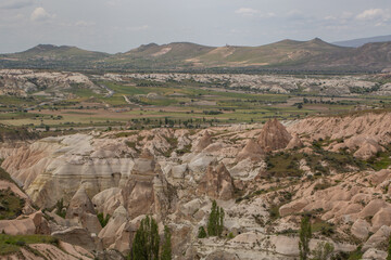 Cappadocia’s colorful rock formations, shaped by wind and water erosion, create a surreal landscape. Layers of volcanic rock reveal history, while valleys and cliffs form an awe-inspiring natural wond
