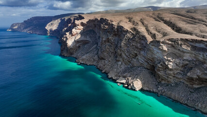 Discover Socotra Islands stunning coastal cliffs and clear blue waters