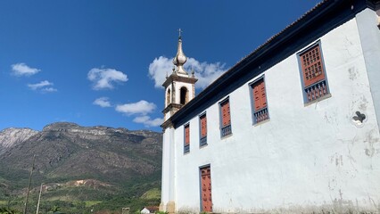 Main church in Catas Altas city, in State of Minas Gerais, in front of the Cara&ccedil;a Mountain, one of the highest mountains in Brazil.