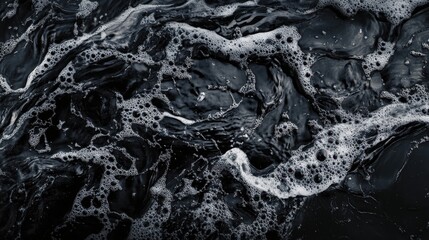 Water splashing on a dark background, creating abstract patterns of droplets and ripples that emphasize freshness and purity.