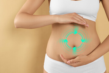 Woman with healthy digestion on dark beige background, closeup. Arrows symbolizing proper functioning of digestive tract