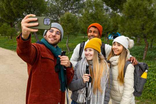 Hikers taking selfie while trekking in the woods