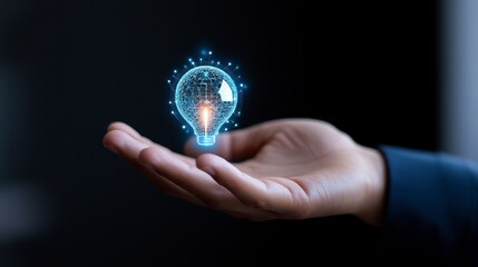 Glowing Blue Lightbulb Held in a Hand Against Dark Background