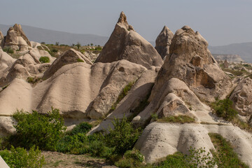 Cappadocia’s colorful rock formations, shaped by wind and water erosion, create a surreal landscape. Layers of volcanic rock reveal history, while valleys and cliffs form an awe-inspiring natural wond