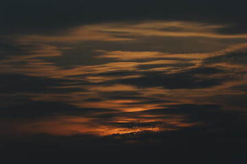 A sunset seen in the sky over a rice field in Nakhon Sawan province, north of Bangkok on February 23, 2025..

