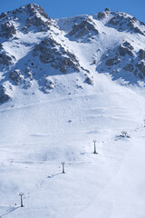 Chairlift on the snowy mountain