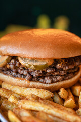 Delicious burger with french fries on white plate