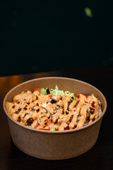 Take out bowl with chicken, fries, letuce, cuumber, tomate and basmati rice