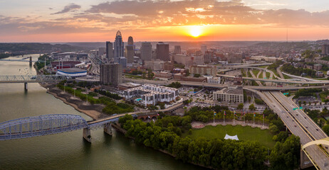 Cincinnati city in state of Ohio with brightly illuminated high skyscraper buildings in downtown...