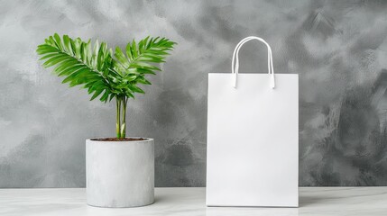 Blank Shopping Bag Beside Plant on Gray Wall
