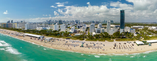 Miami Beach is popular vacation spot in southern Florida. Sandy beach surface and tourist...