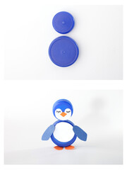 tutorial, Two blue plastic bottle caps repurposed into a penguin figure with drawn face and paper wings. Perfect for recycling campaigns, kids crafts, promoting creative upcycling