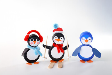black and blue plastic bottle caps transformed into penguin crafts. Perfect for recycling initiatives, kids activities, and creative repurposing. handmade toys, Christmas activities