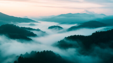 Obraz premium Early morning landscape. Foggy. River valley in the morning fog at sunrise. View from above. Rays of the sun breaking through the fog in over the trees. Athmosphere quite and calm
