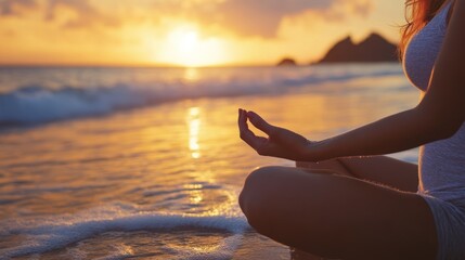 Woman practicing yoga on the beach