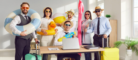Happy business team ready for their summer vacation together. Group of cheerful, smiling coworkers...