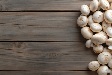 Fresh button mushrooms on rustic wooden background.