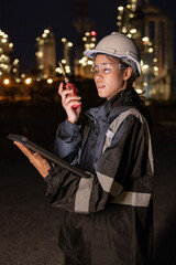 Engineers Conducting Night Inspection at Refinery