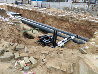 Construction site with laying underground communications. Reconstruction of the heat pipeline. The...