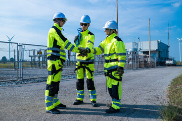 Engineers with equipment assessing wind farm site