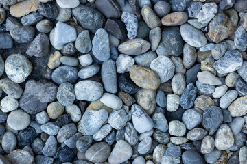 Close-up of a pebble-patterned walkway surface.