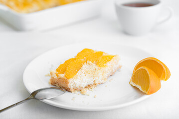 Pie with cottage cheese and oranges on a plate