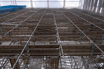 High scaffolding structure under construction beams