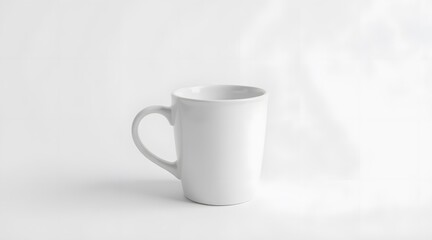 A sleek white ceramic mug stands out against a soft, bright background, emphasizing its minimalist design and inviting warmth.  