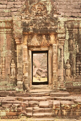 Elaborate doorway, door, gate, entrance at the Prasat Preah Khan Temple, flanked by two soldiers, warriors, ornaments carved into the sandstone, Angkor Wat, Siem Reap, Cambodia